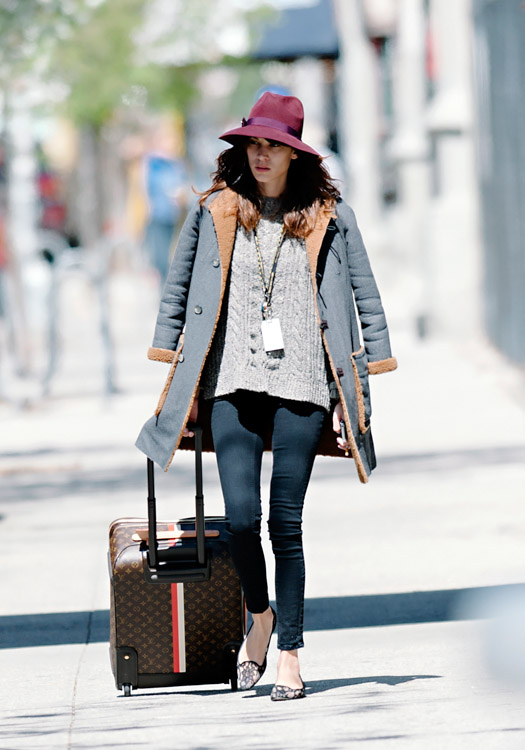 Alexa Chung wheels a Louis Vuitton suitcase around Manhattan