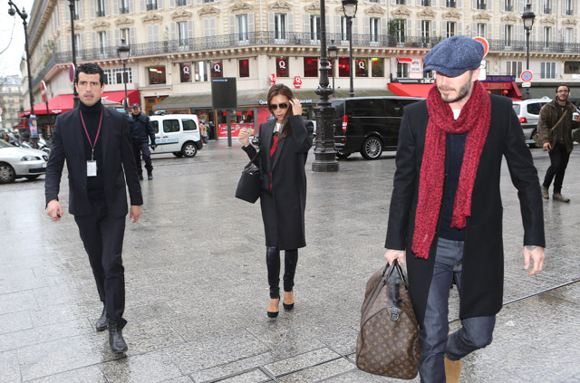 David Beckham, carrying his Louis Vuitton travel bag, gets a