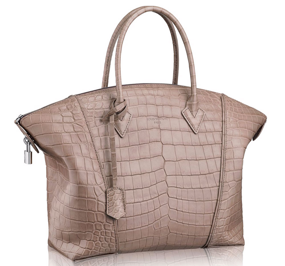 Louis Vuitton White Ostrich Lockit MM Bag . Excellent Condition., Lot  #58385