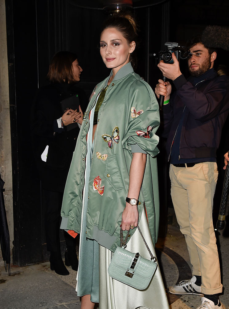 Olivia Palermo in green fur coat with green shoulder bag in New