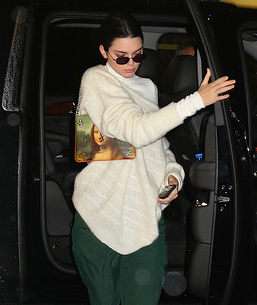Kendall Jenner with Louis Vuitton coin purse, January 7, 2012