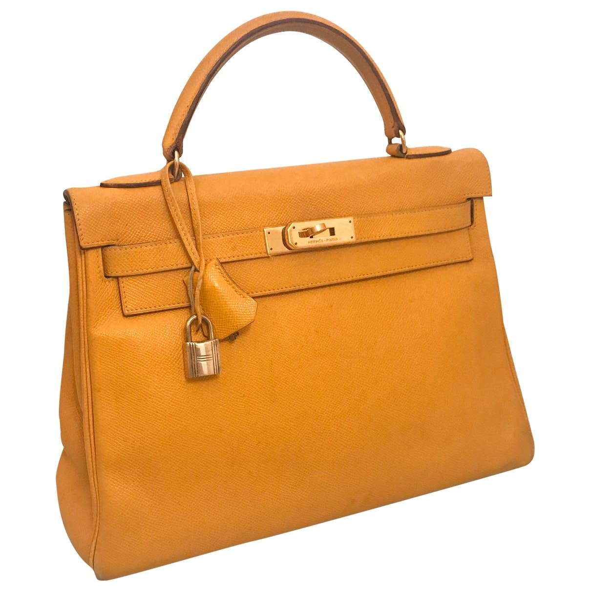Will people think this is a knock-off Kelly? I love this Tory Burch Lee  Radziwill bag, but couldn't help overlook the similarities between it and  the Hermes Kelly. While I do love
